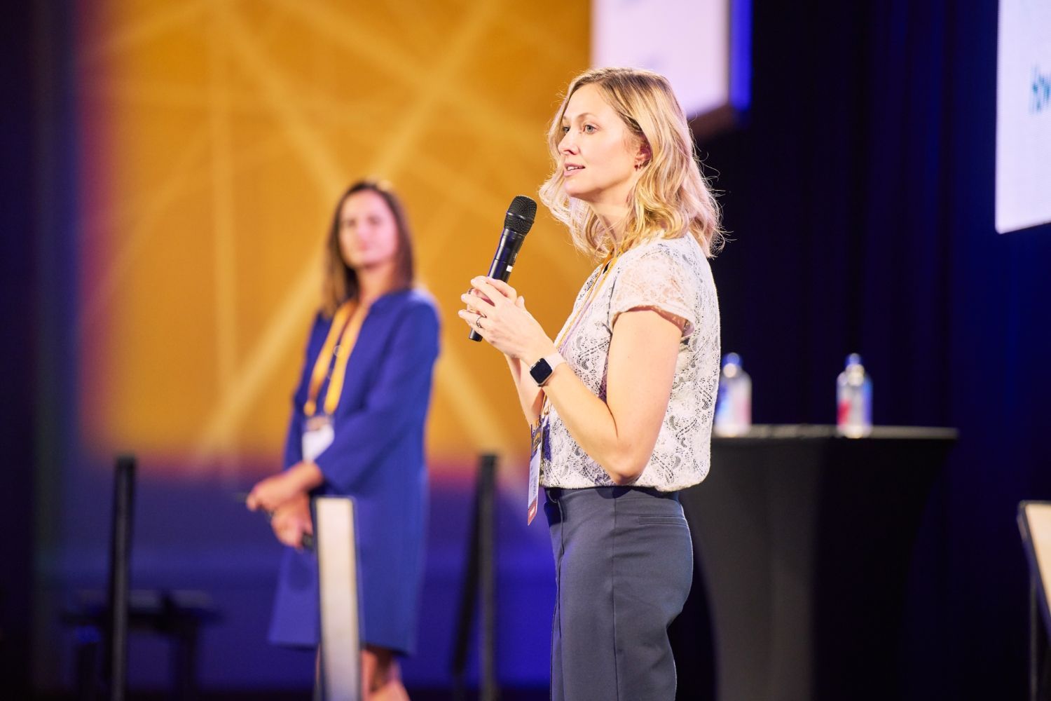 Dr. Heidi Strohmaier discusses techniques for dealing with stress at HAP26, while Dr. Jackie Henry looks on
