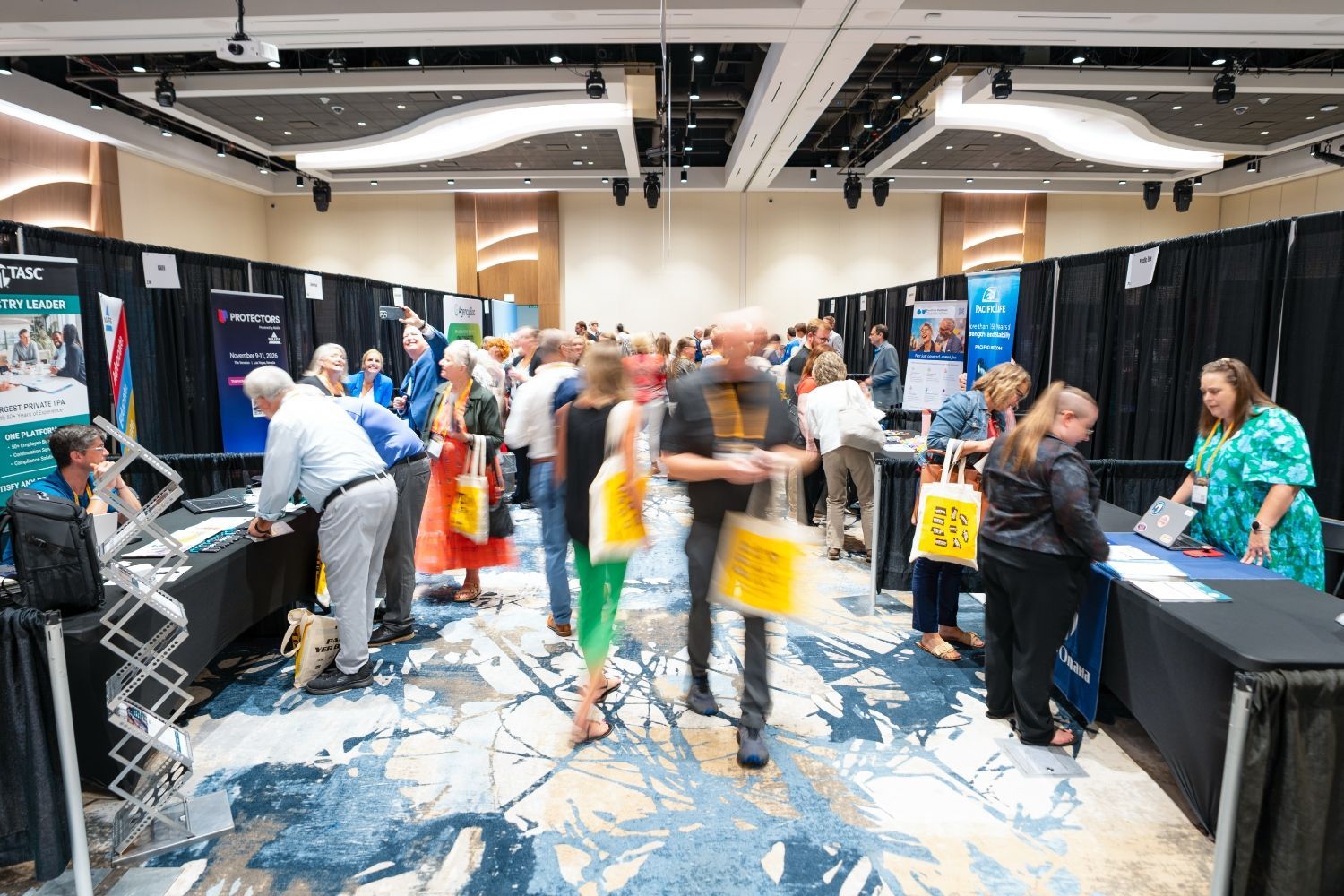 Agents visit sponsor booths at HAP26